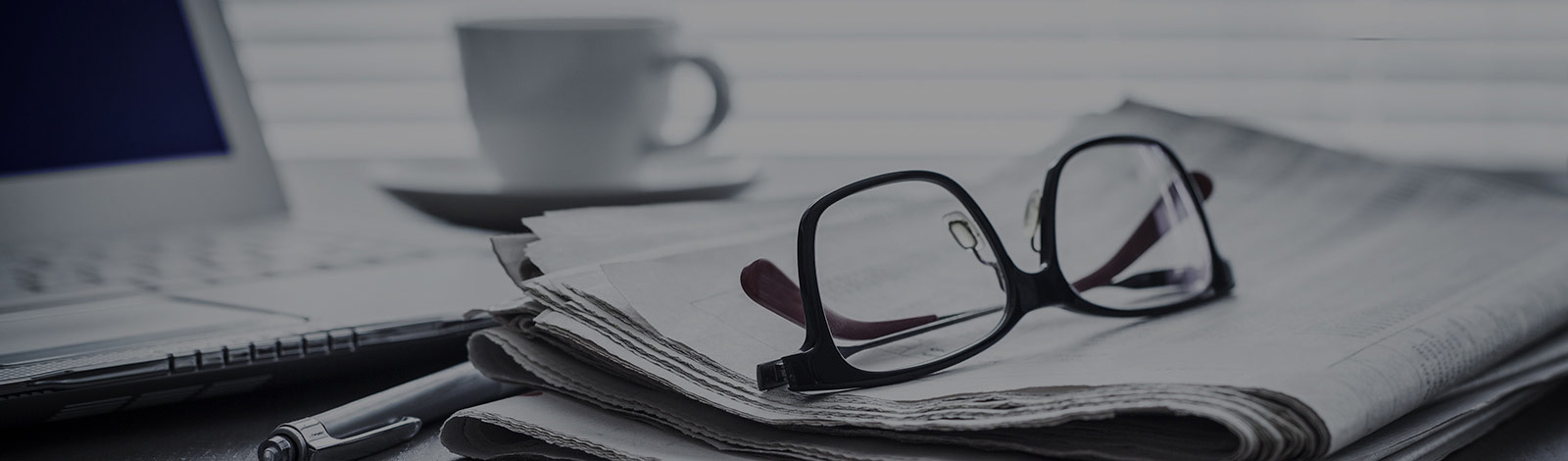 A pair of glasses on newspaper